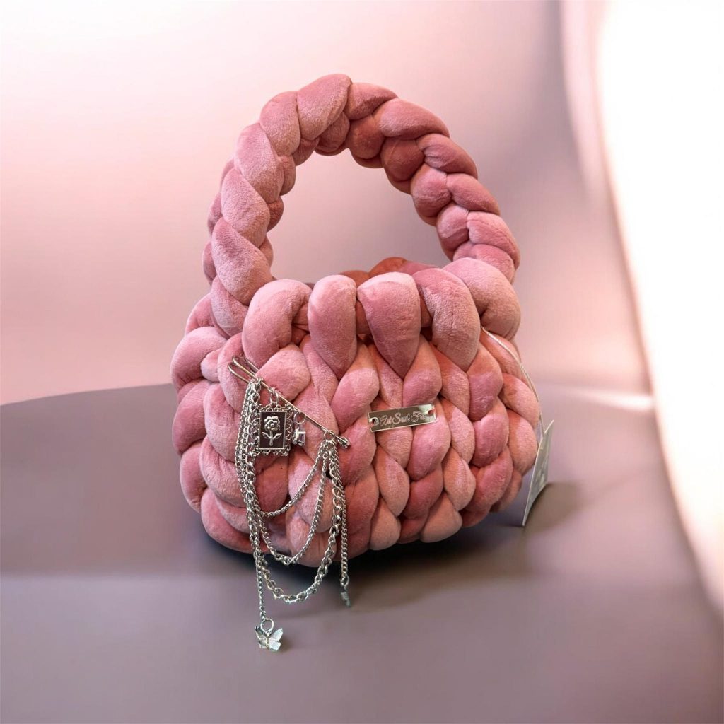 Fox Essence dusty rose handmade bag Fox Essence handmade woven bag in dusty rose with soft texture and decorative chain details