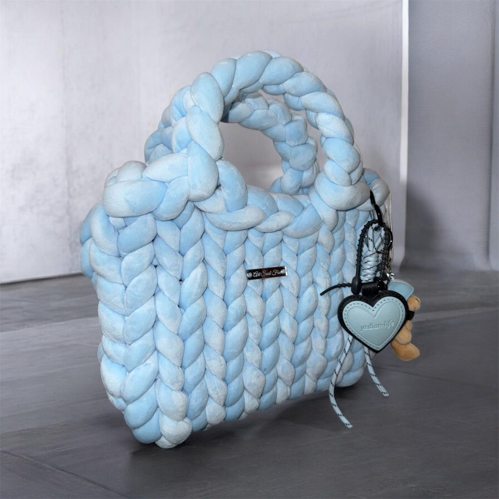 Fox Prestige light blue handmade bag Fox Prestige handmade woven bag in light blue with soft braided texture and custom charm details